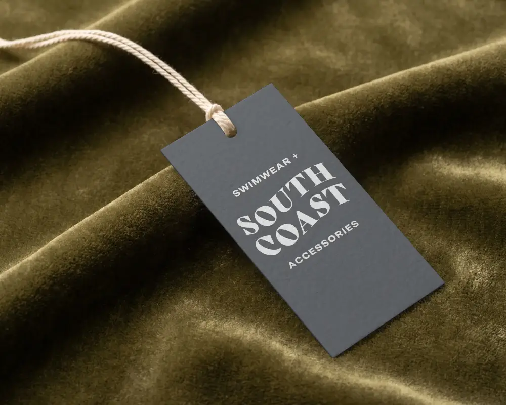 Minimalistic Plain Rectangle Label Mockup With String On Wrinkled Fabric Backdrop