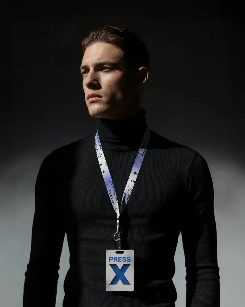 Sleek Lanyard Mockup Male Model In Black Turtleneck Under Dramatic Light And Shadow