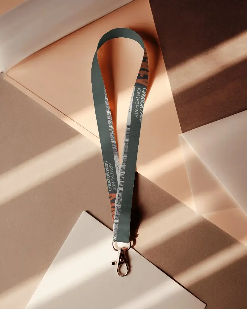 Modern Lanyard Mockup On Geometric Paper Sheets With Warm Sunlight And Soft Shadows