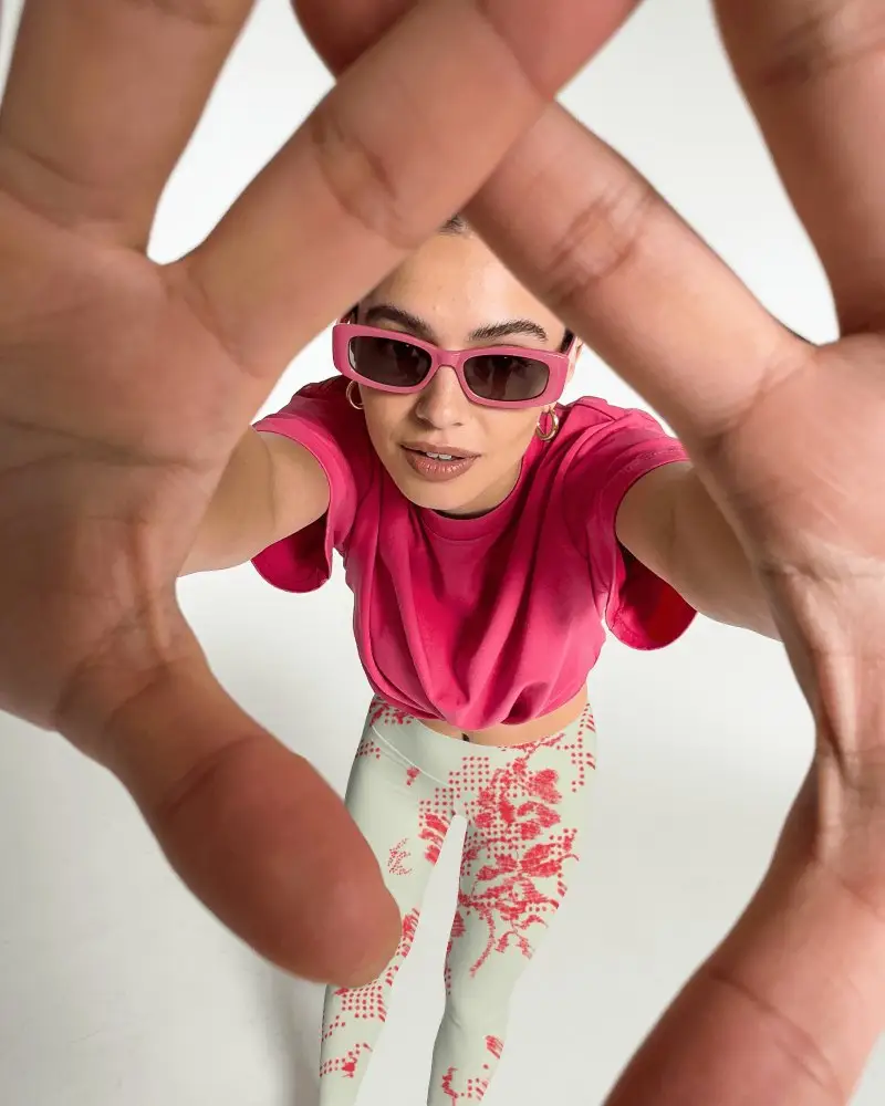 Fisheye Leggings Mockup With Female Model Reaching Toward Camera Through Framed Hand Gesture