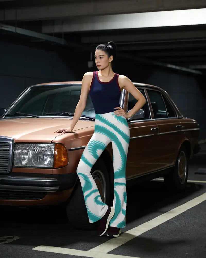 Fashion Model Flared Leggings Mockup Posing Beside Vintage Car In Parking Garage