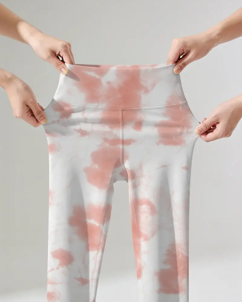 Stretch Test Leggings Mockup Held By Four Hands Showing Waistband And Fabric Flex