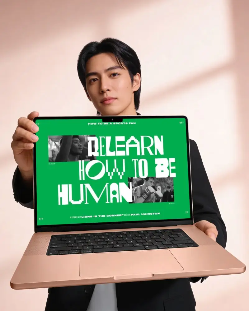 Male Model Holding Macbook Pro M5 Mockup With Blank Screen For Digital Presentations