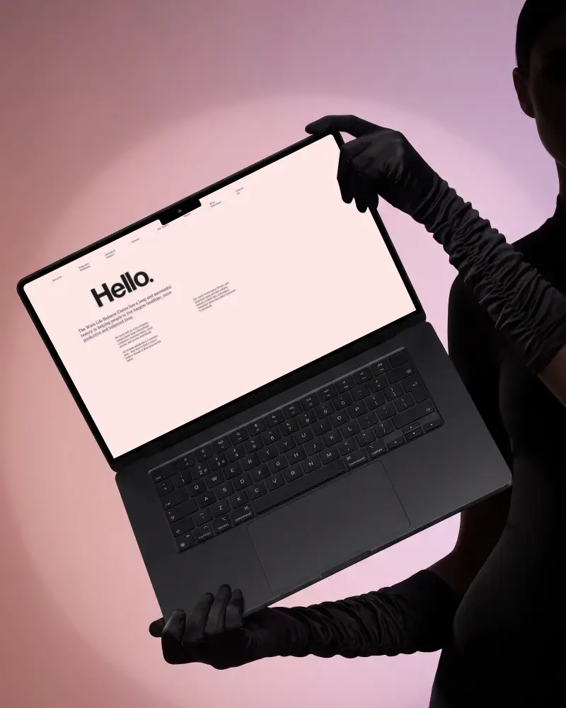 High Resolution Macbook Pro M3 Mockup Angled View With Black Gloved Hands Holding Device