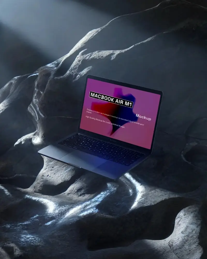 Floating Macbook Air M1 Laptop On Rock Textured Surface With Dramatic Lighting And Empty Screen