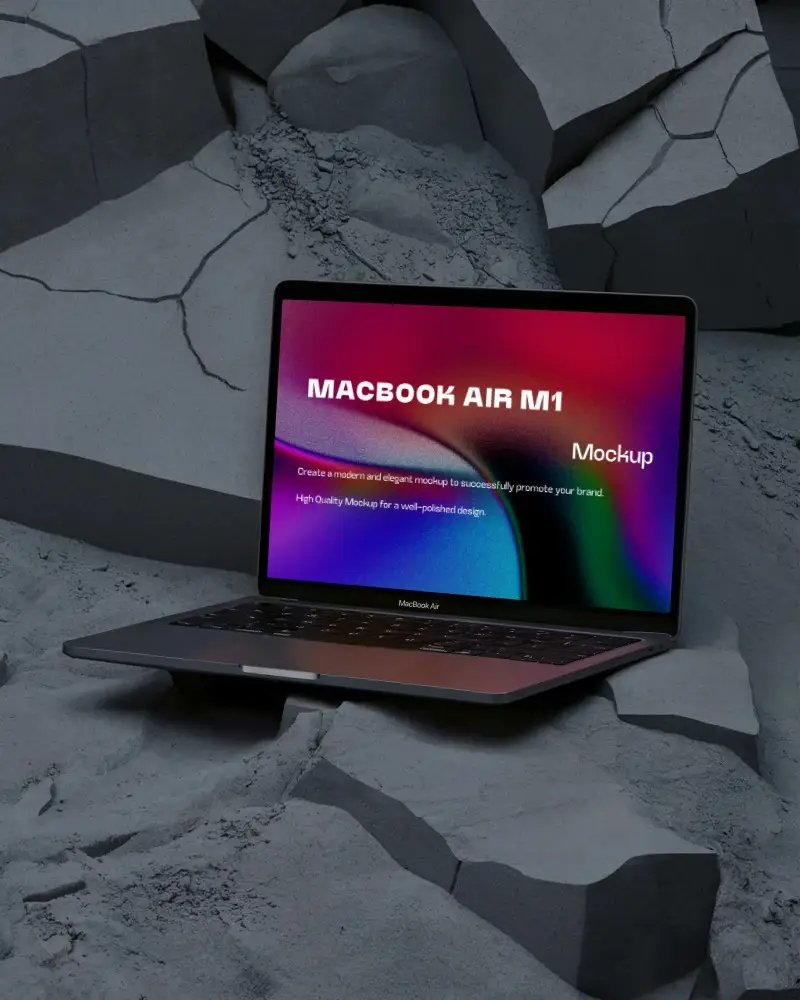 Macbook Air M1 Mockup On Cracked Volcanic Surface With Deep Shadows And Textured Grey Stone Backdrop