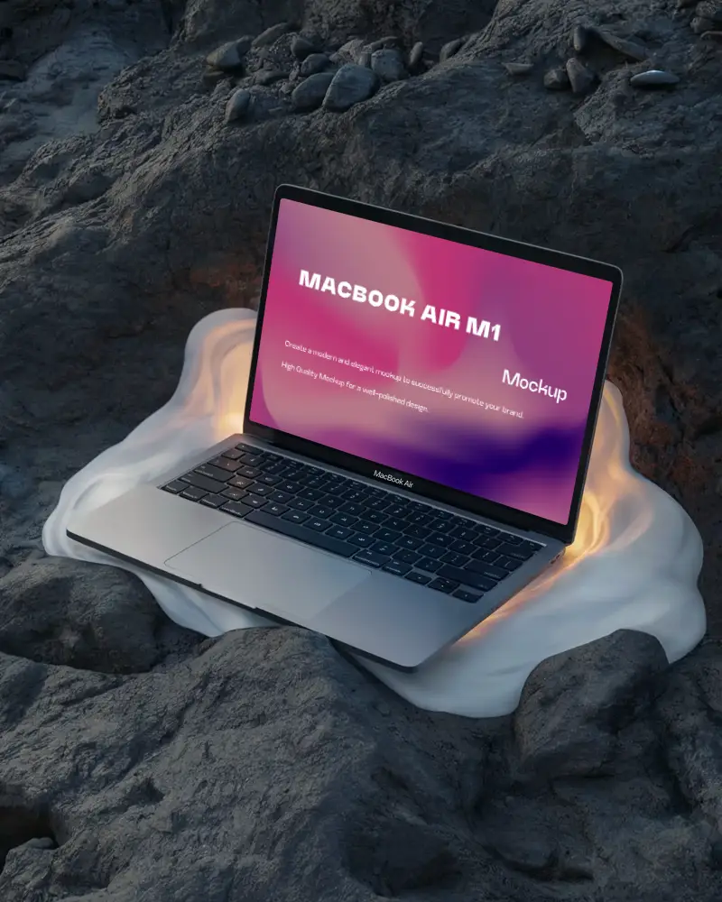 Macbook Air M1 Mockup Resting On Molten Cloth Over Rough Volcanic Rocks Glowing Edges Organic And Surreal Visual Style
