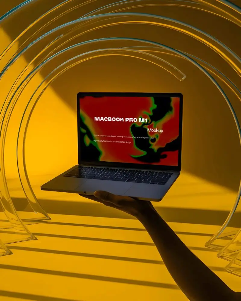 Macbook Pro M1 Mockup Held In Hand With Clear Arches And Yellow Backdrop Light Play