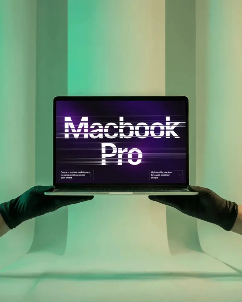 neon-lit-lab-style-macbook-pro-m1-mockup-held-by-black-gloves-in-vertical-light-panel