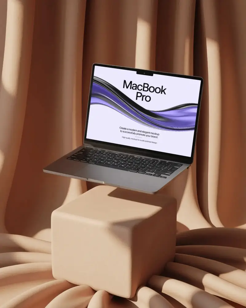 elegant-studio-drape-macbook-m2-pro-mockup-floating-above-cushioned-beige-fabric-block