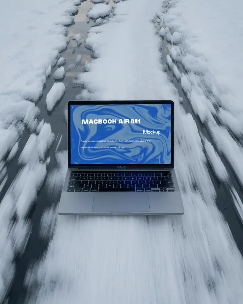 Winter Road Macbook Air M1 Mockup Placed On Snowy Path With Motion Blur And Frozen Scenic Vibes