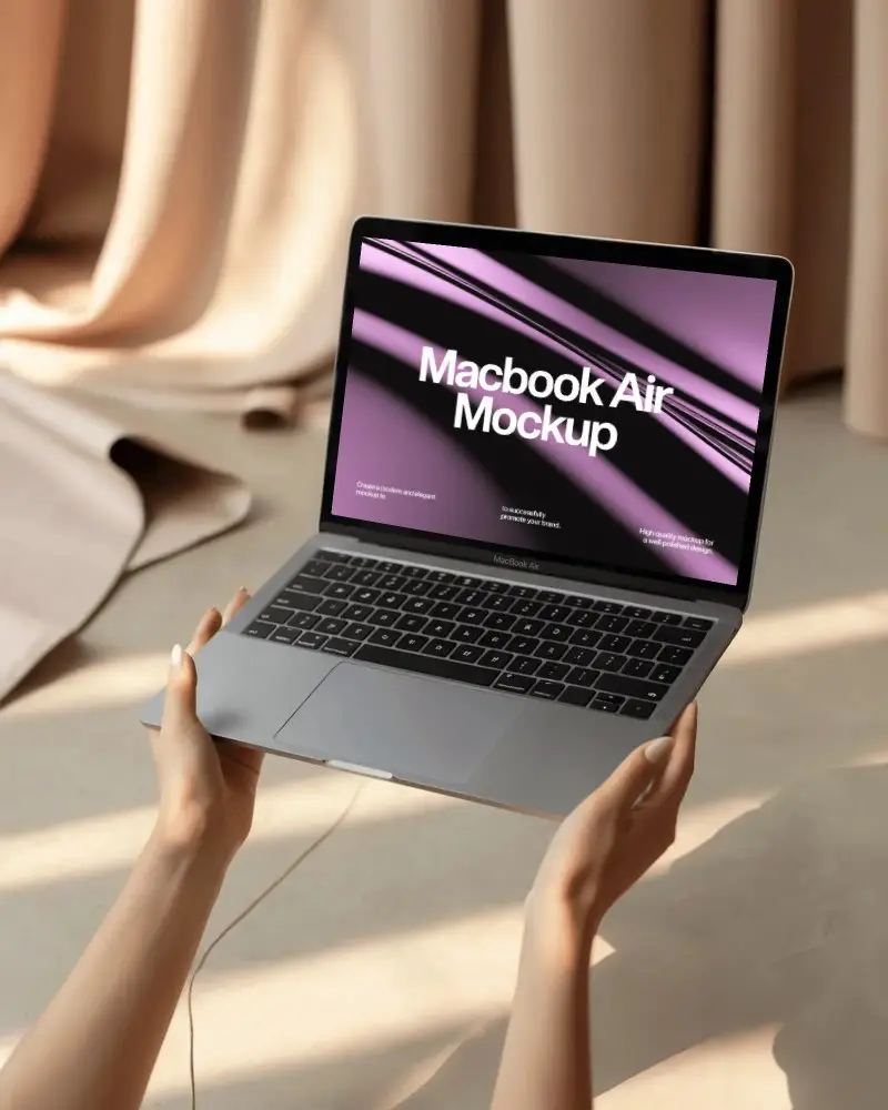 Hands Holding Macbook Air M1 Mockup In Soft Sunlight With Curtains And Warm Floor