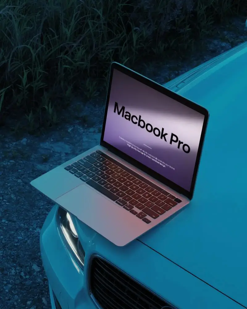 Blue Hour Macbook Pro M1 Mockup On Car Hood With Headlight Glow And Rural Gravel Road