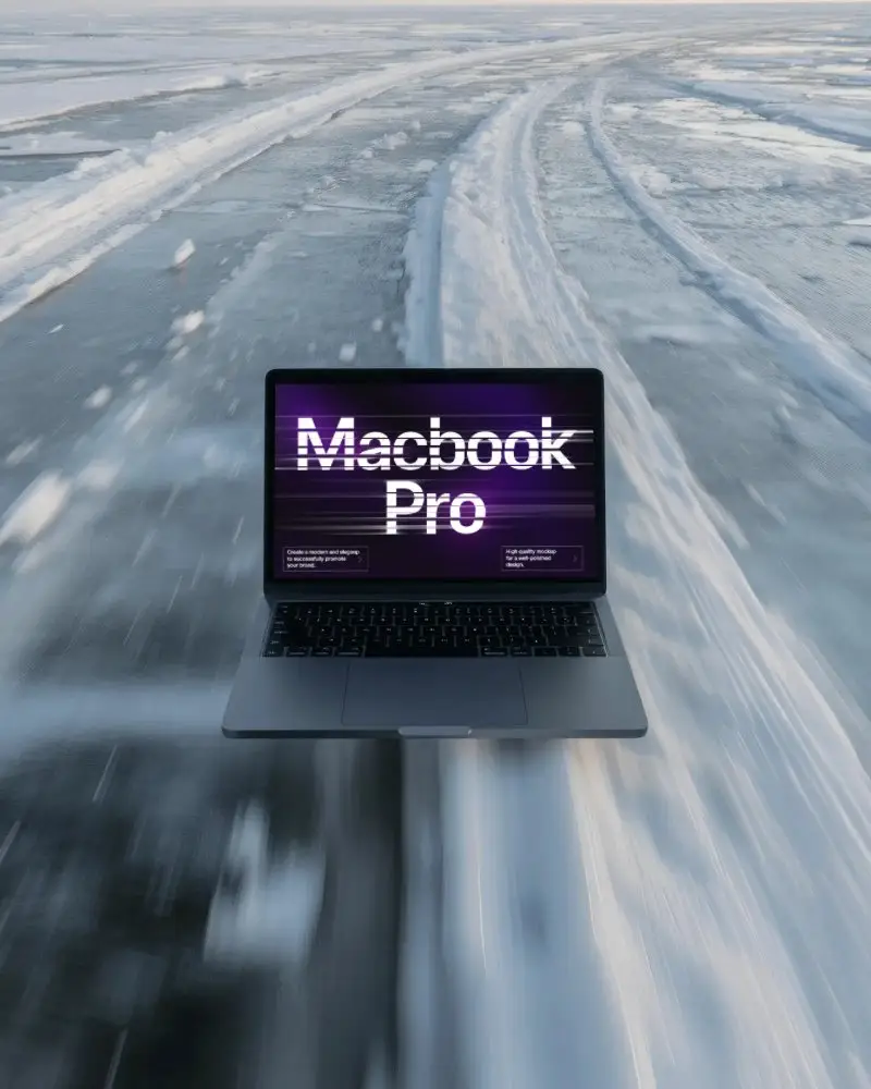 Macbook Pro M1 Mockup Floating Above Icy Road With Speed Motion And Snow Trail Pattern
