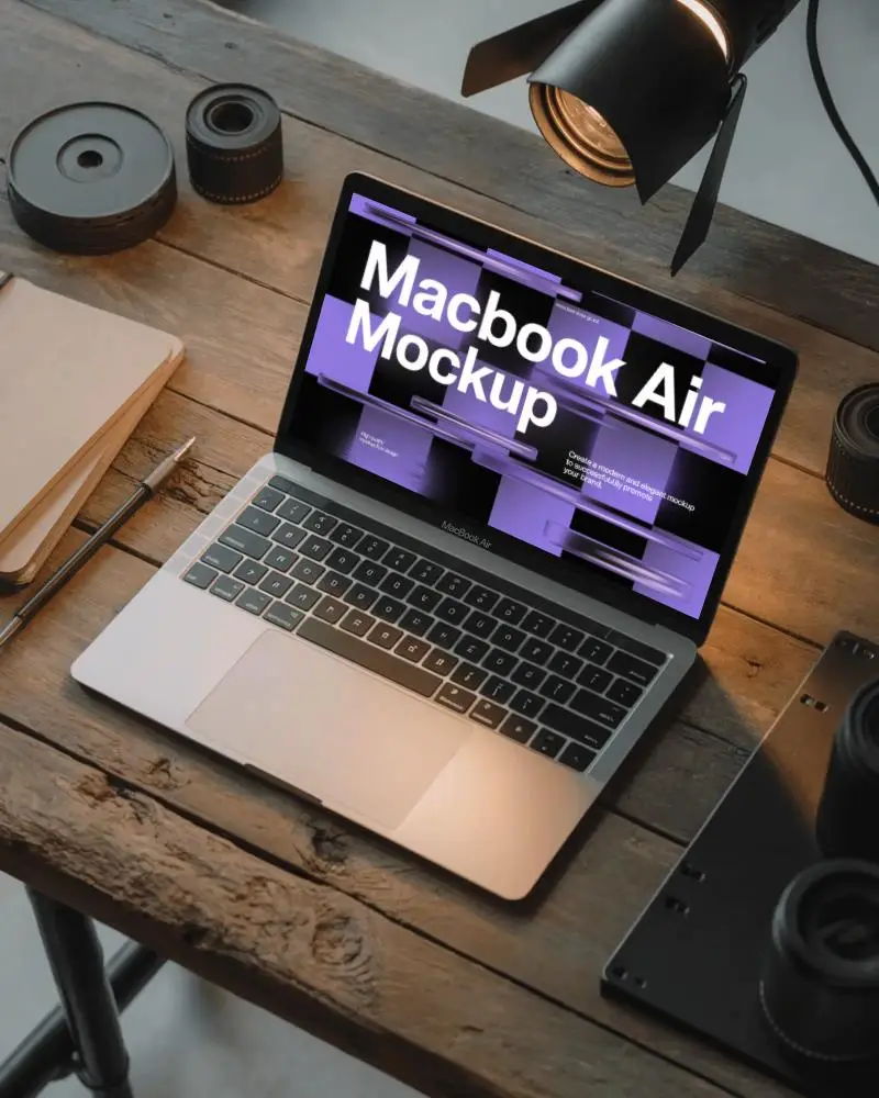 Rustic Wood Desk Macbook Air M1 Mockup Surrounded By Camera Gear And Soft Light