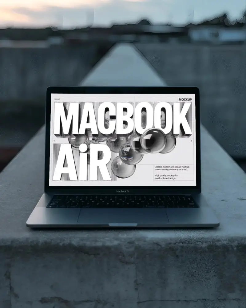 minimalist-mockup-of-macbook-air-m1-on-sunset-lit-wall-in-quiet-cityscape-environment