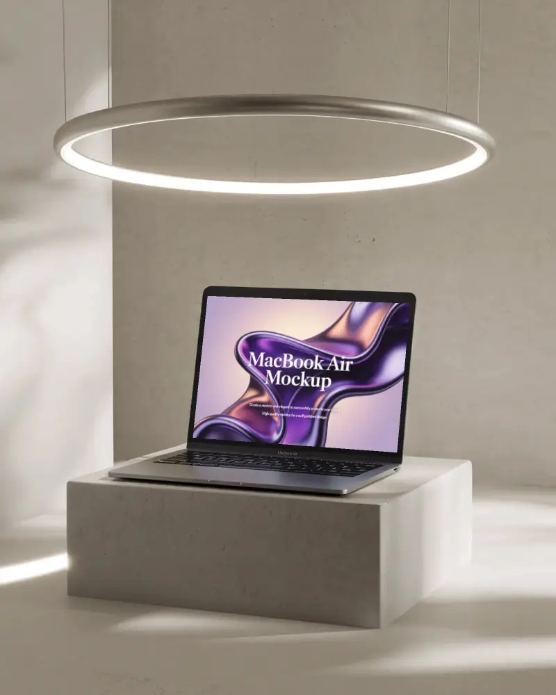 minimalist-macbook-m1-air-mockup-on-cement-block-under-glowing-halo-light-ring