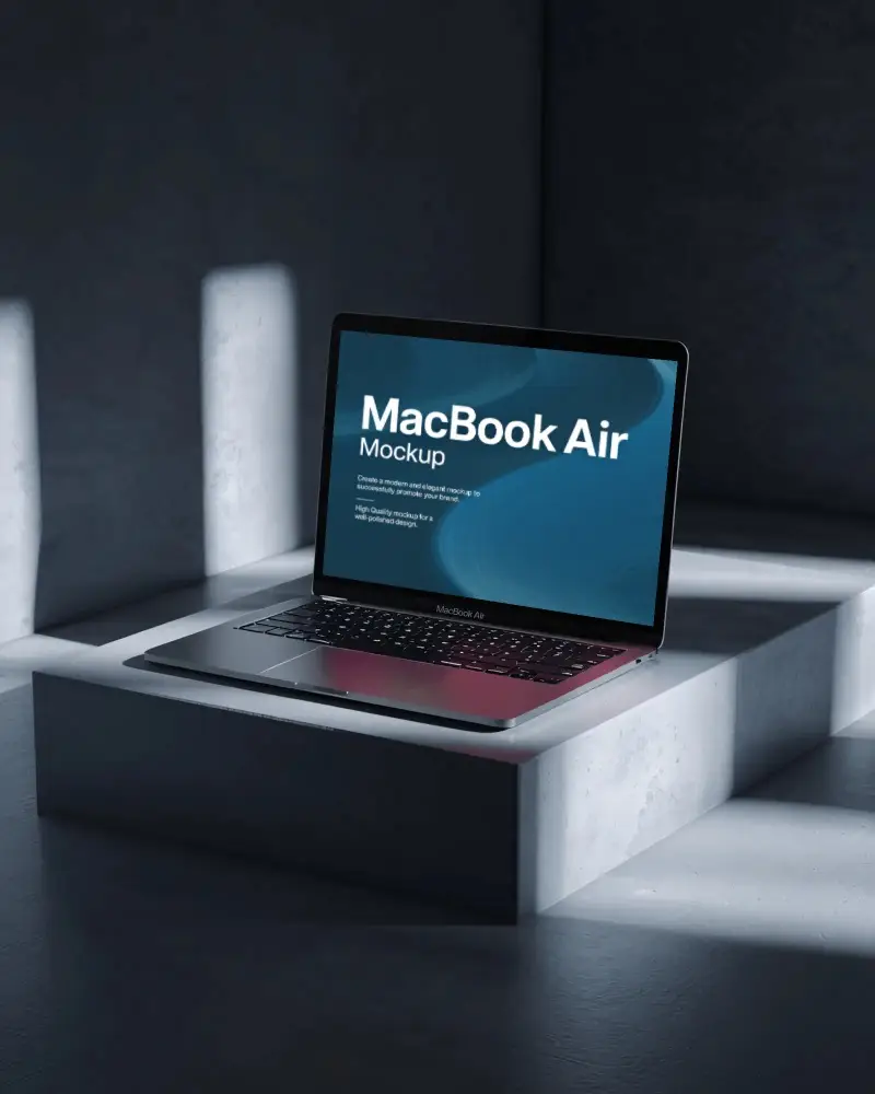 macbook-m1-air-mockup-on-concrete-platform-with-dramatic-light-and-deep-shadow-box