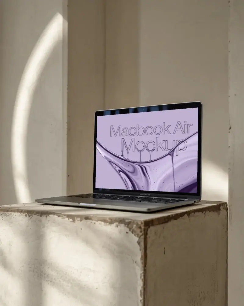 macbook-m1-air-mockup-on-rough-plaster-podium-in-warm-sunlight-and-shadows-studio-scene