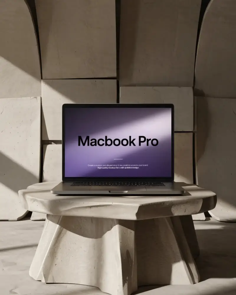 macbook-m1-pro-mockup-on-carved-stone-pedestal-in-sunlit-architectural-interior