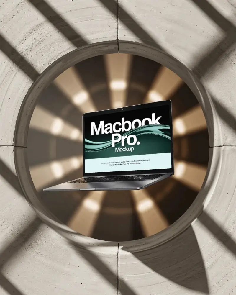 macbook-pro-m1-mockup-floating-in-sunburst-lit-circular-wall-opening-with-architectural-shadows