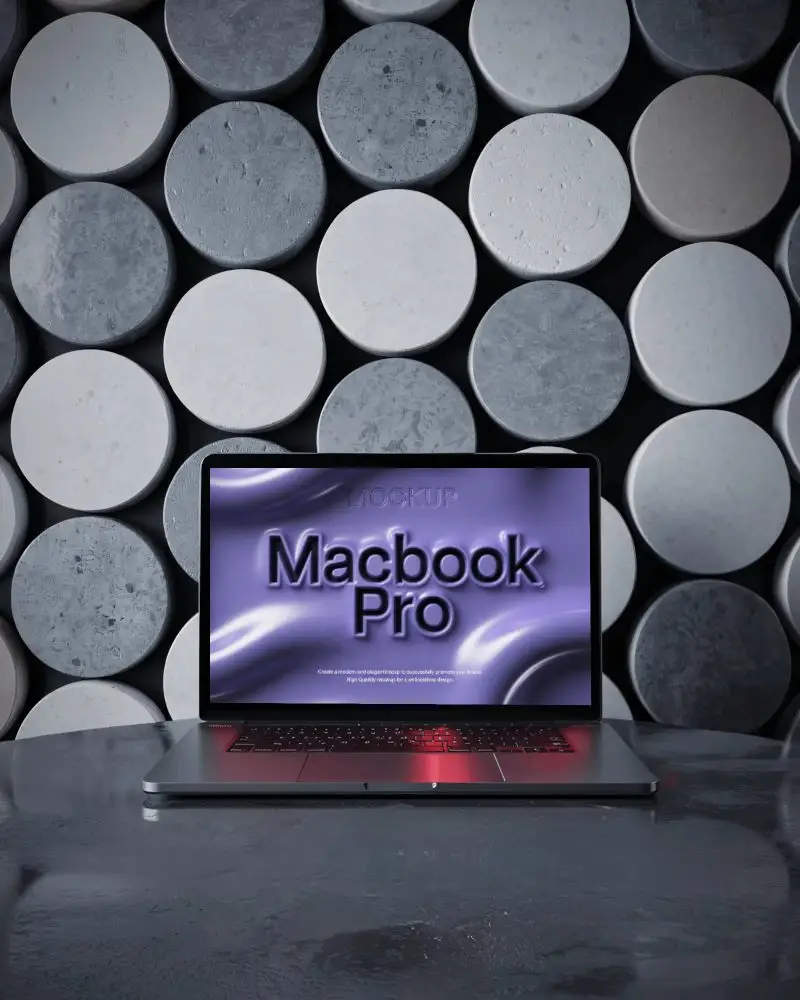 M1 Pro On Polished Black Surface Against Textured Cylinder Wall In Dark Minimal Scene