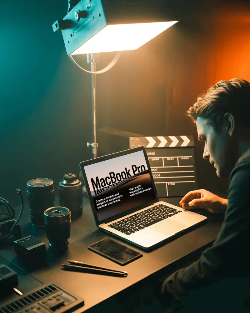 Director Workstation Macbook M1 Pro Mockup Surrounded By Lenses And Clapperboard