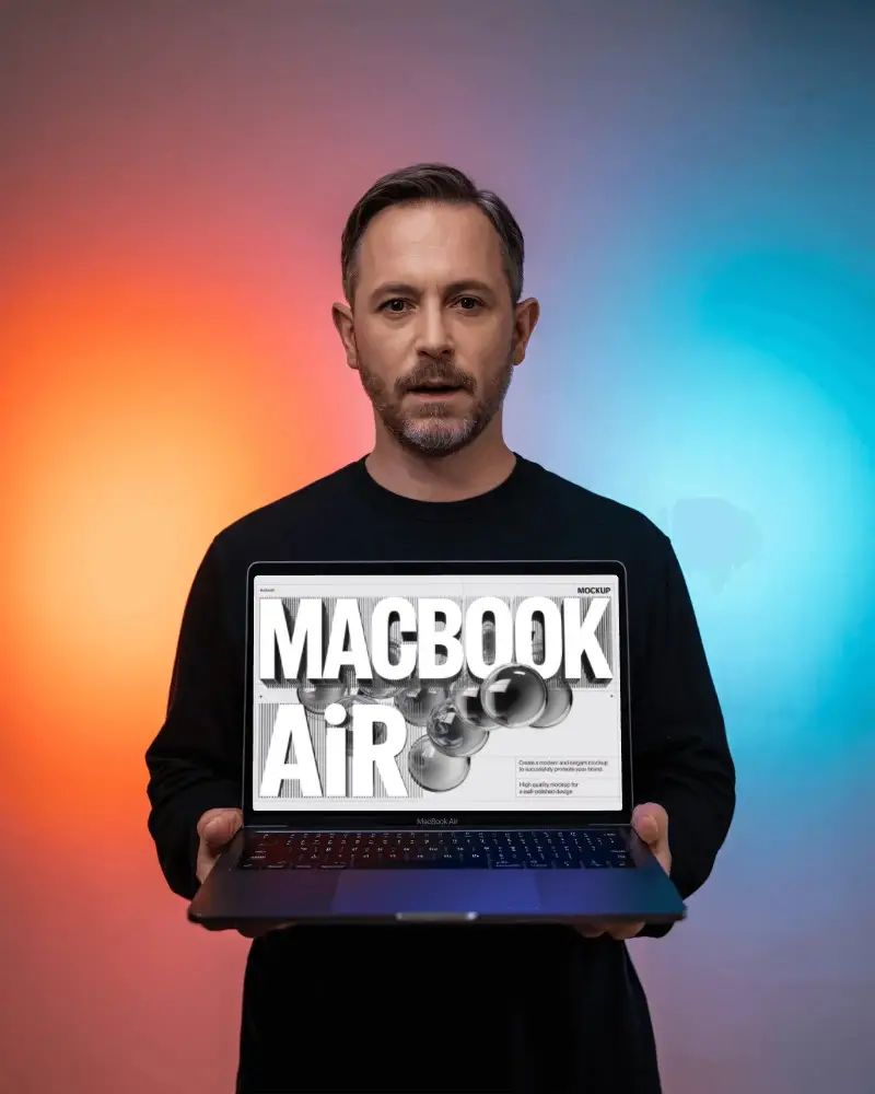 Studio Bicolor Glow M1 Air Mockup Presented By Man In Centered Composition