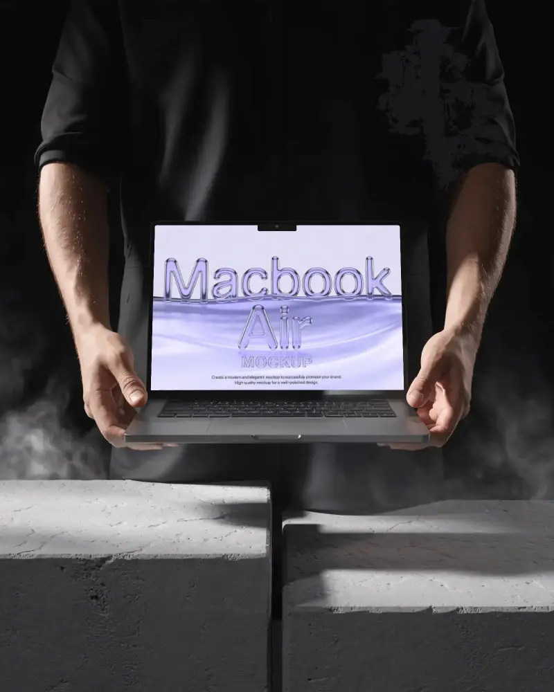 Powerful Macbook M3 Air Mockup Gripped By Hands In Dark Industrial Scene With Rising Smoke