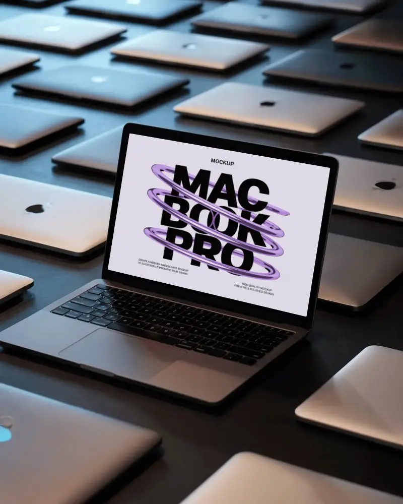 Macbook Pro M1 Mockup Among Multiple Closed Laptops With Moody Studio Light And Modern Depth