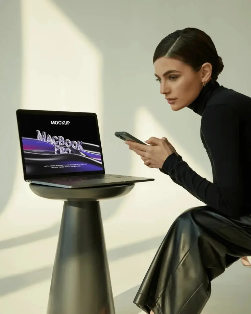 Macbook Pro M1 Mockup With Focused Woman Using Phone In Soft Natural Light And Modern Studio Style