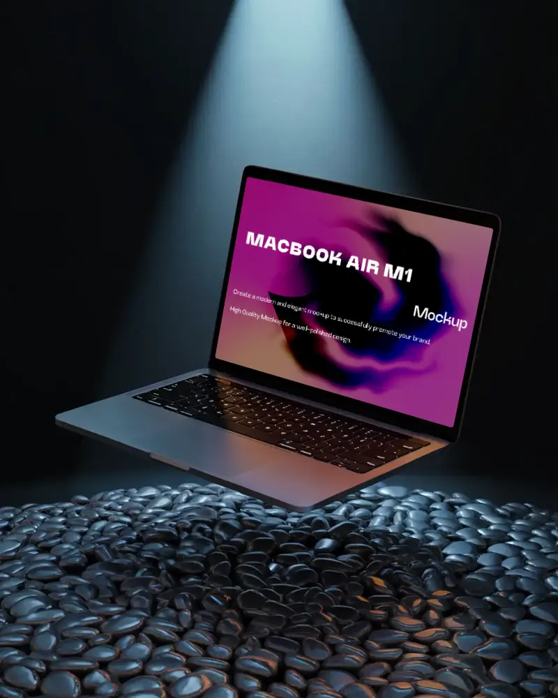 Macbook Air M1 Mockup Floating Above Wet Polished Pebbles Under Dramatic Spotlight Moody And Reflective Presentation Style