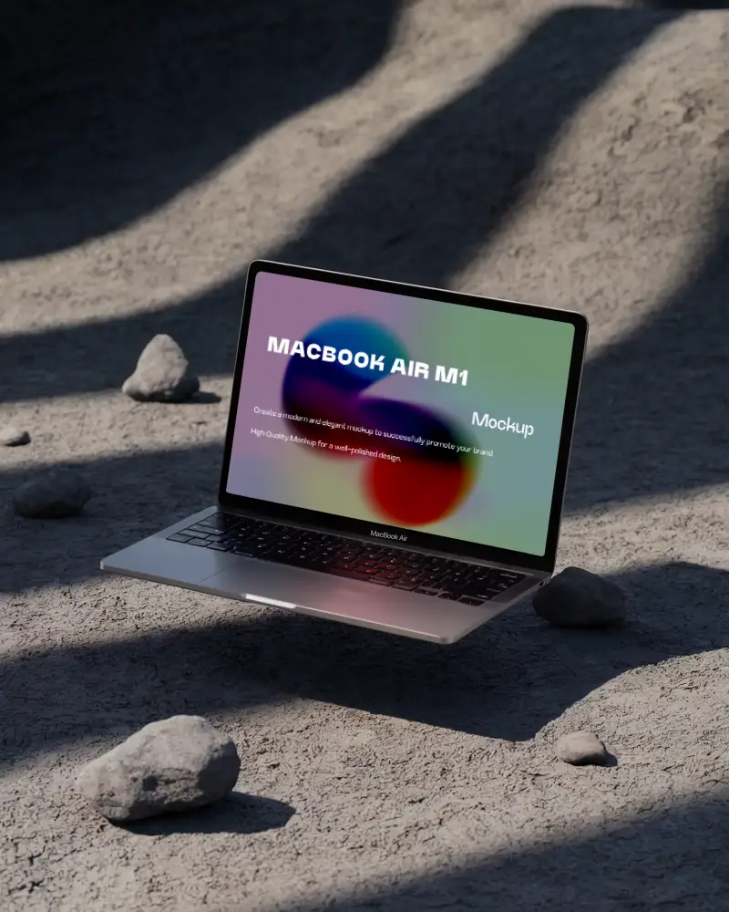 Macbook Air M1 Mockup Hovering Above Dusty Ground With Scattered Rocks And Harsh Directional Shadows Raw And Minimalist Setting