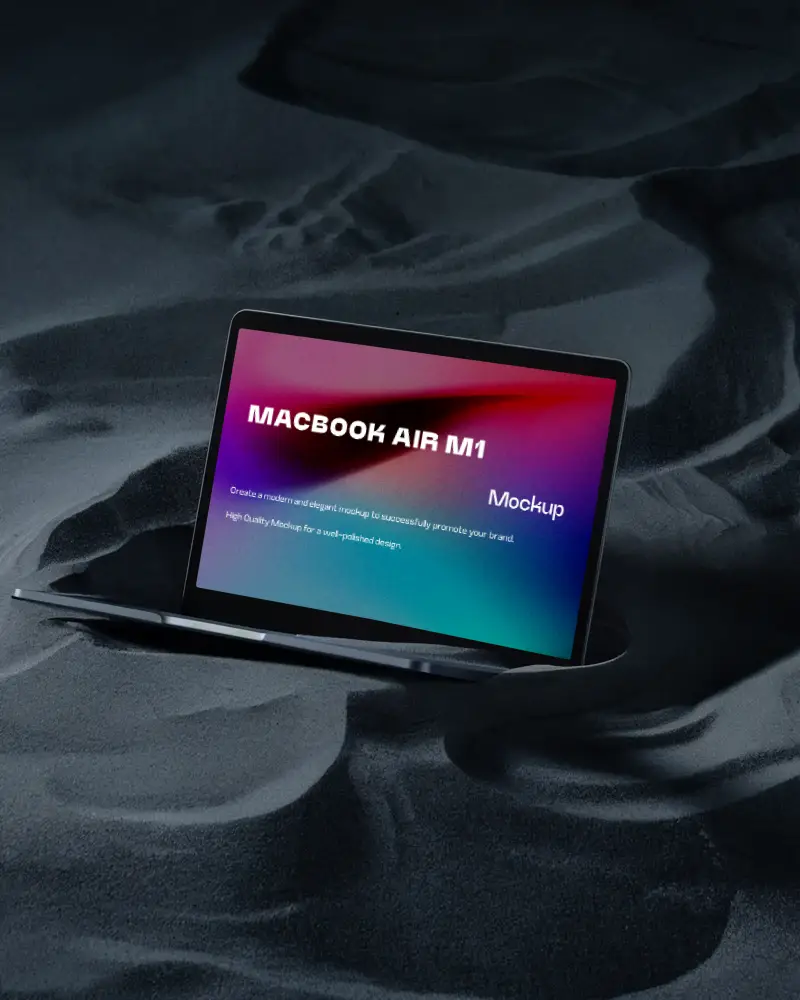 Macbook Air M1 Mockup Partially Submerged In Black Sand Dunes With Soft Contours And Deep Shadows Minimal And Mysterious Atmosphere