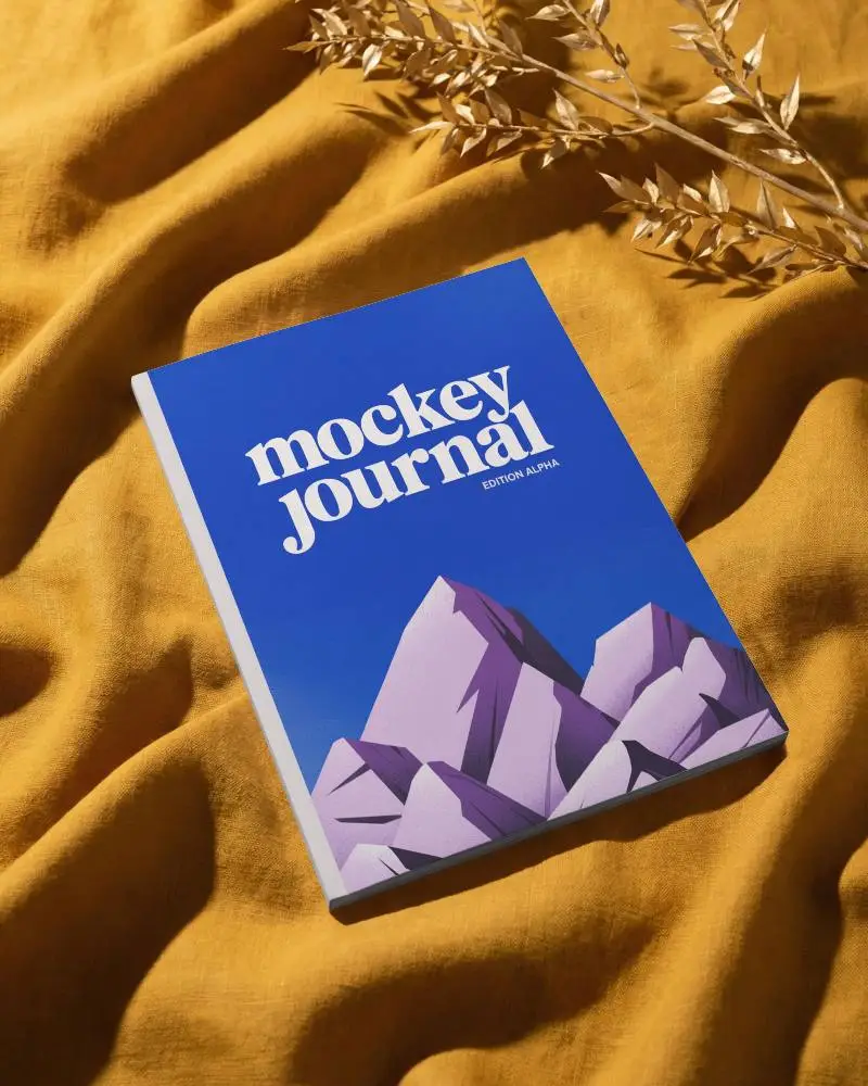 Clean Minimal Cover Magazine Mockup Laid On Natural Fabric With Decorative Leaves