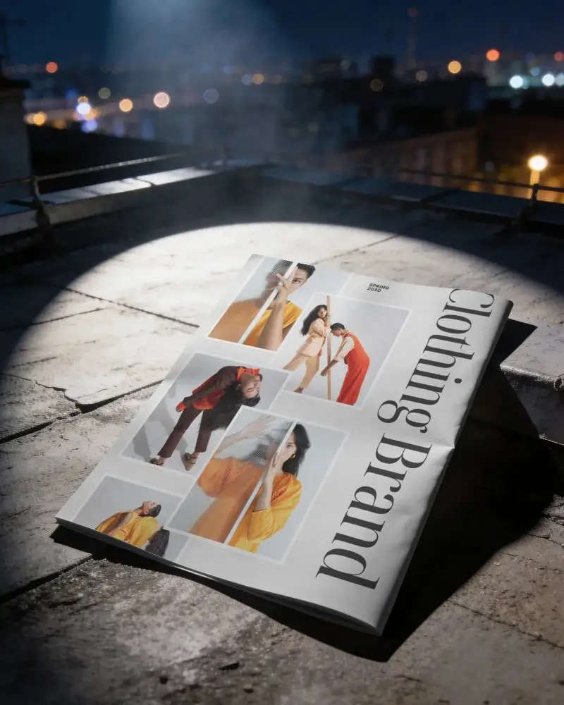 Contemporary Folded Magazine Mockup Lighted On Textured Stone Surface In Cityscape Setting