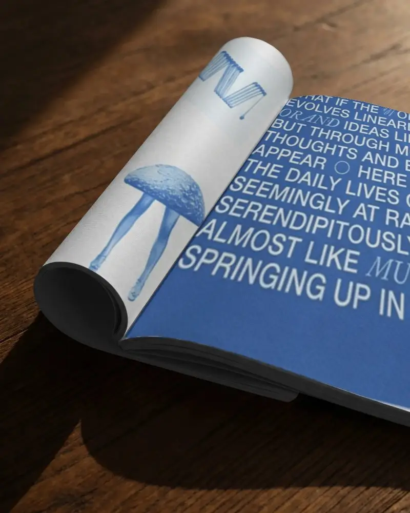 High Resolution Magazine Mockup Open Flat Rolled Pages Displayed On Wooden Table