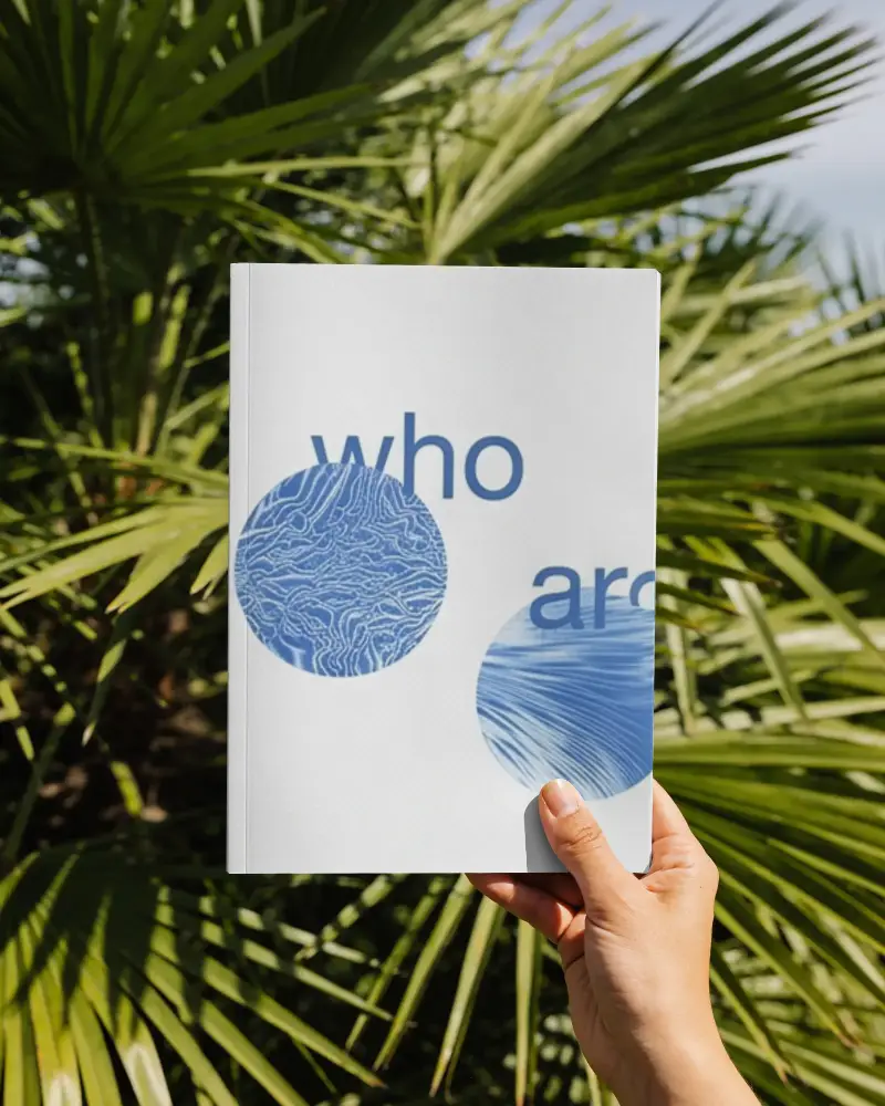 Hand Holding Minimalist Magazine Mockup Outdoor With Natural Greenery Background Image