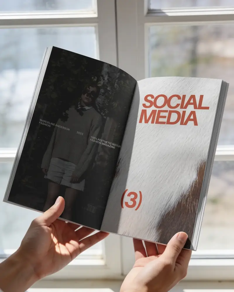 Magazine Mockup Showing Clean Empty Spread Held By Two Hands By Window