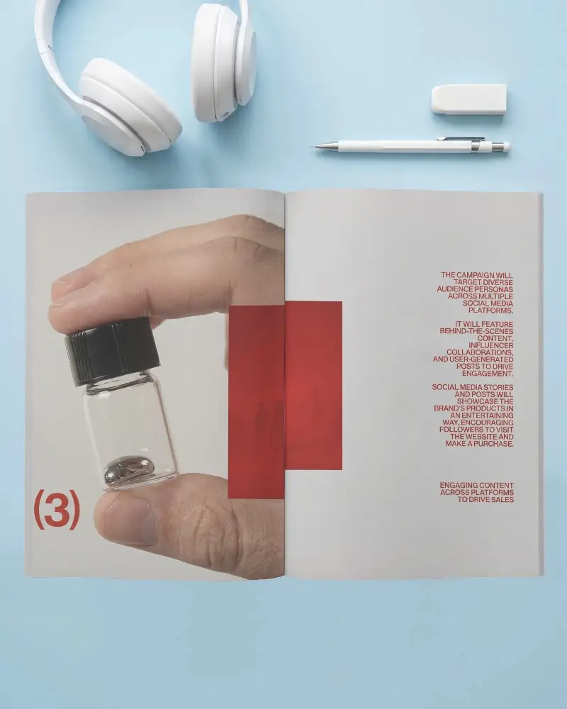 Open Magazine Mockup With Headphones Pen And Eraser On Tabletop Background