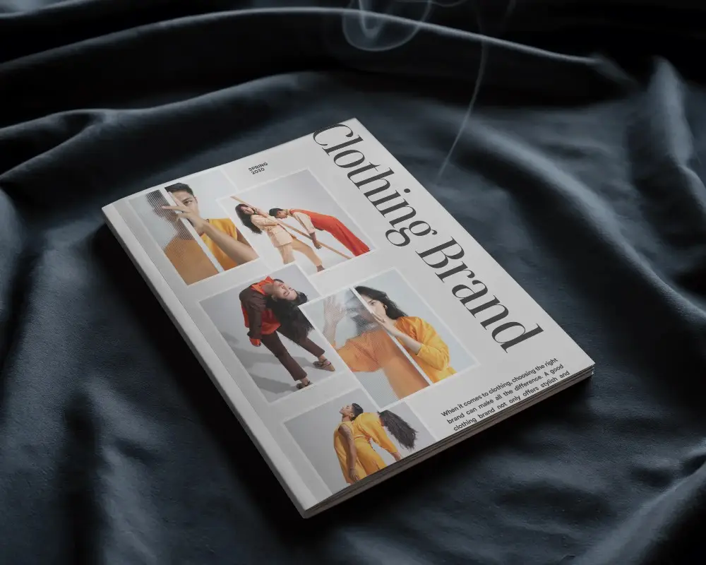 Angled Softcover Magazine Mockup On Dark Fabric Surface With Subtle Smoke Cozy And Moody Atmosphere 0204