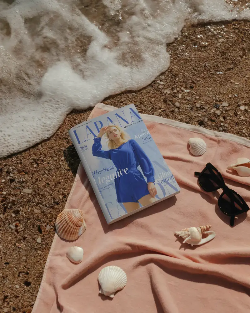 Beachside Editorial Magazine Mockup Closed Cover On Sand With Seashells And Sunglasses Near Ocean Waves For Summer Brand Presentation 0310