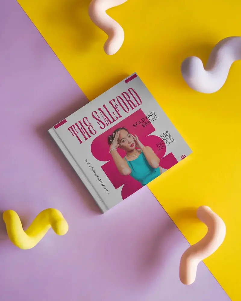 Flat Lay Hardcover Magazine Mockup On Dual Tone Yellow And Lilac Background With Colorful Abstract Clay Shapes Creative Studio Setup 0307