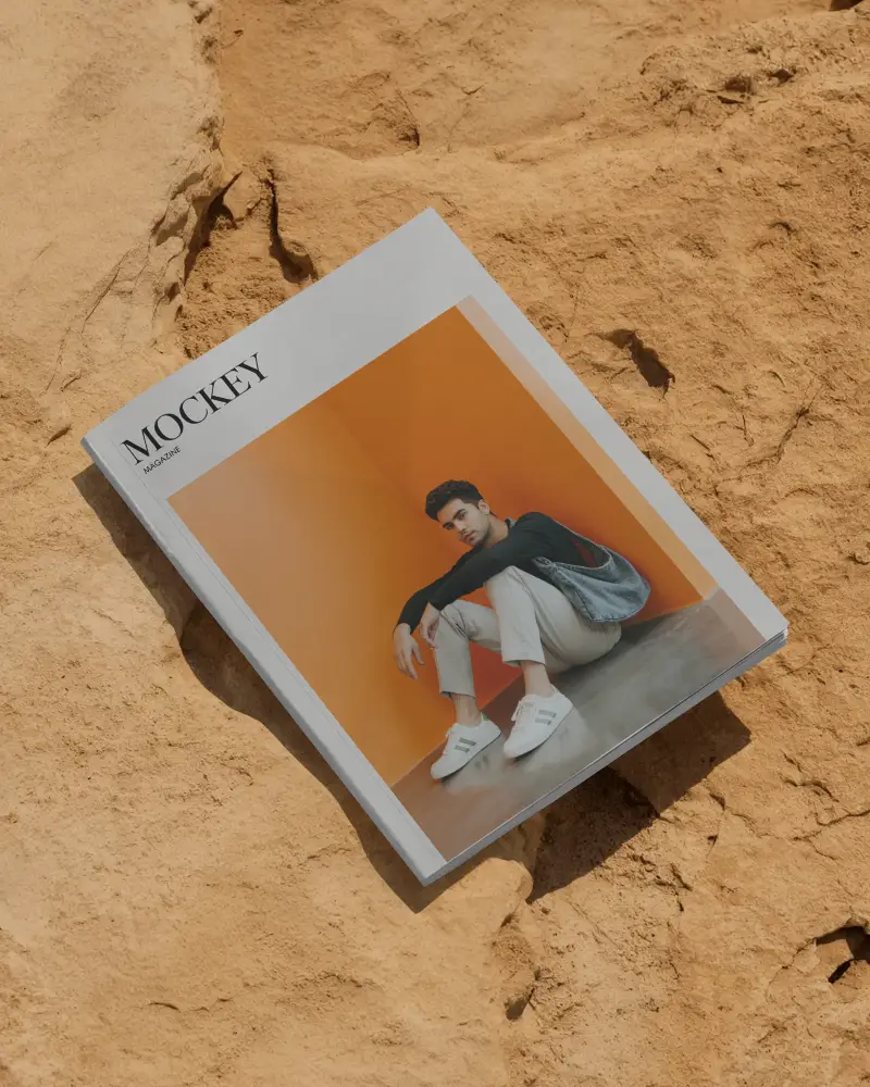 Hardcover Magazine Mockup Placed On Textured Sandy Surface Creative Product