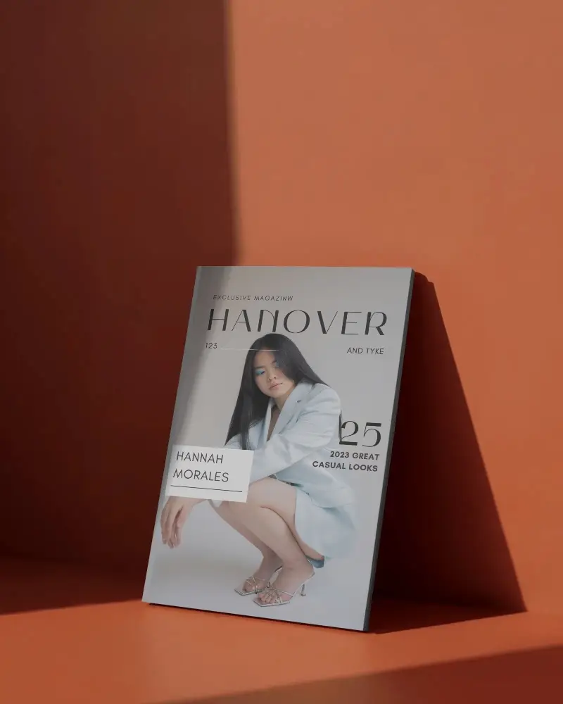 Elegant Magazine Mockup In Warm Studio Lighting Casting Soft Shadow On Modern Orange Background