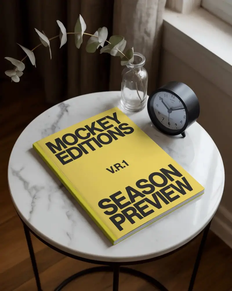 clean-magazine-mockup-layout-with-marble-tabletop-and-simple-vase-clock-accessories