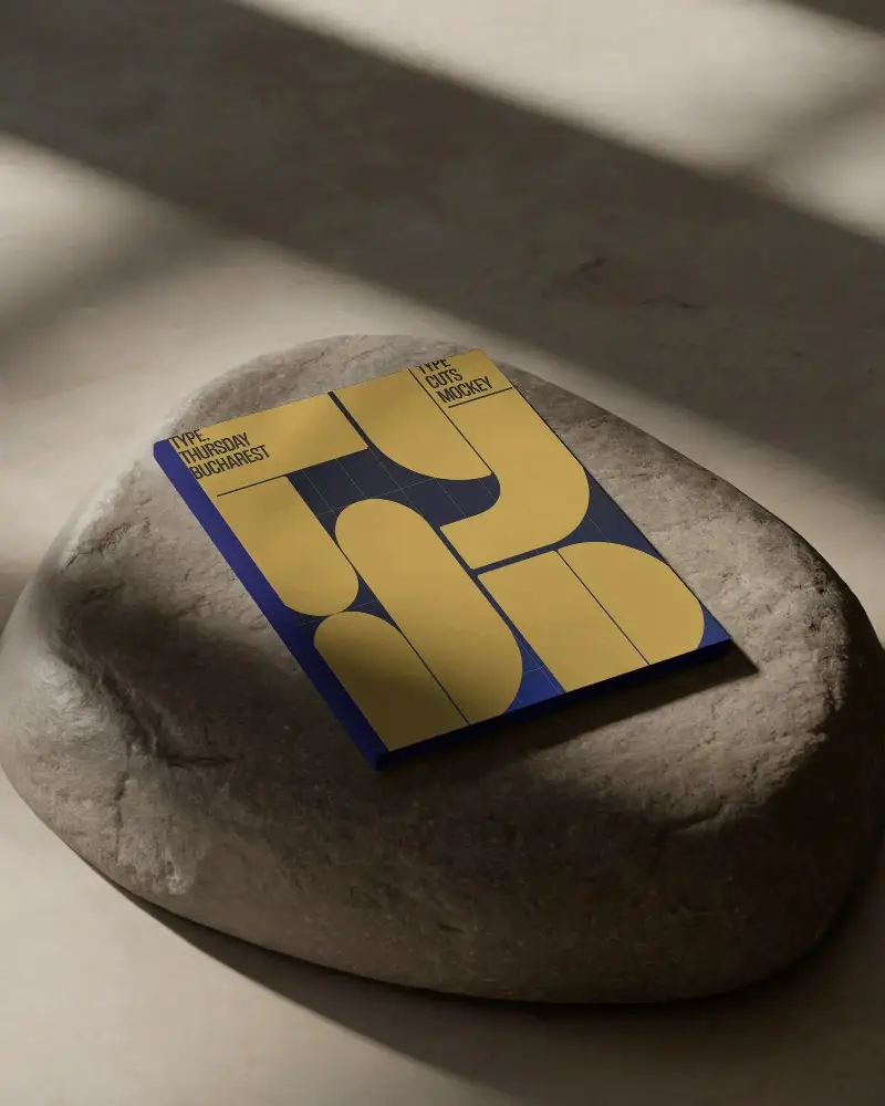 artistic-shadow-play-magazine-mockup-on-textured-stone-surface-for-modern-presentations