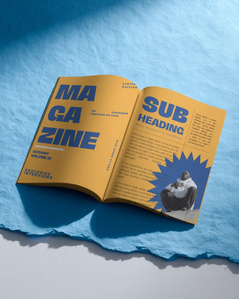 open-magazine-mockup-on-blue-paper-creative-flatlay