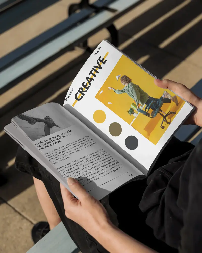 Person Holding Open Blank Magazine Mockup Outdoor Seated On Bench Sunny Day