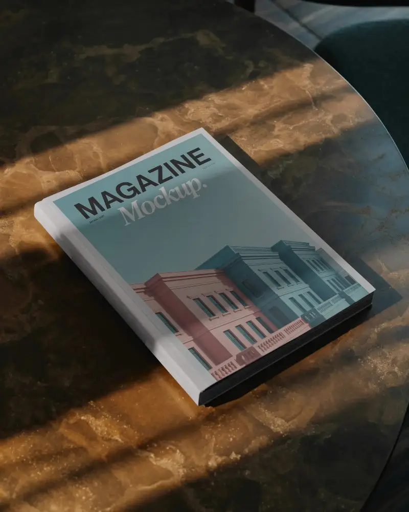 Hardcover Magazine Mockup Placed On Marble Table Under Dramatic Soft Light Shadows